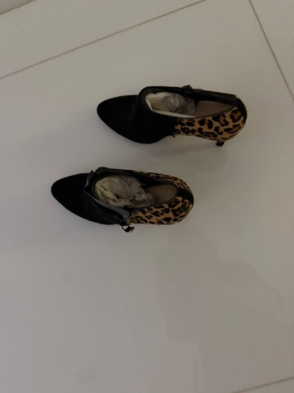 Suede leopard boot shoe with black suede front and heel.